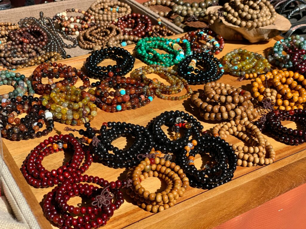 assorted-colored beaded necklaces on display