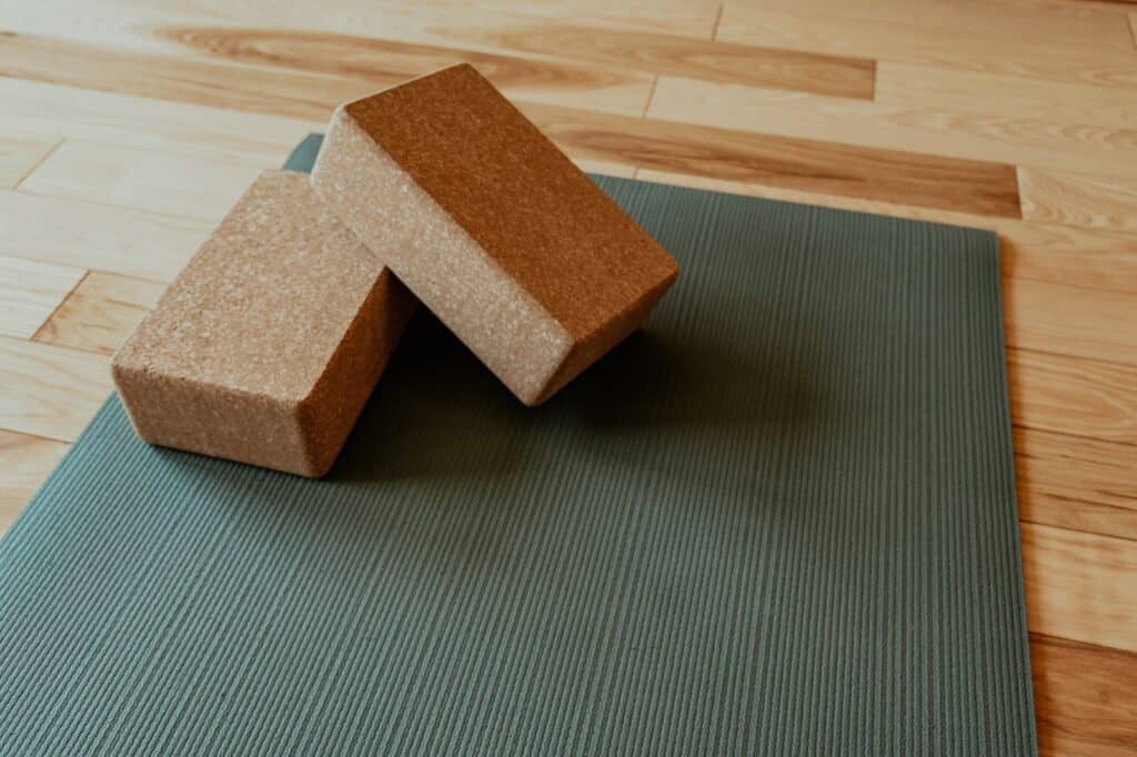 a yoga mat with two blocks on top of it