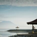 brown gazebo near sea closeup photography