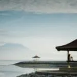 brown gazebo near sea closeup photography
