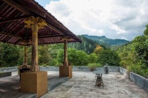 Mountain-view terrace with wooden gazebo and seating