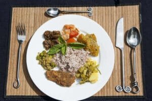 Plate of rice with assorted side dishes