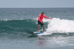 Man surfing on small ocean wave