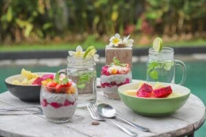 Chia pudding and fruit bowls by poolside