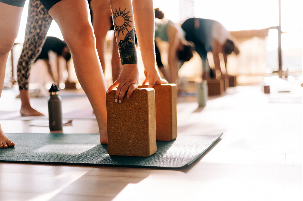 Person using cork yoga blocks in class