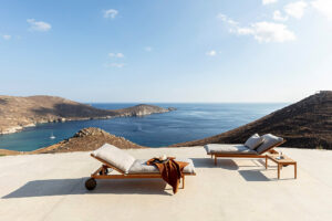 Luxury loungers overlooking serene coastal bay