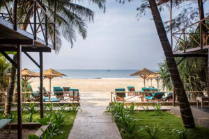 Tropical beach resort with lounge chairs and ocean