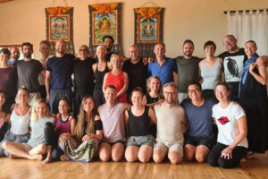 Group of people posing in yoga studio