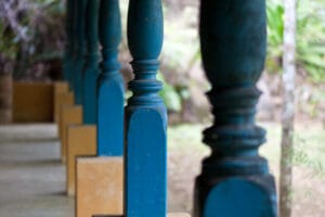 Row of blue wooden porch columns