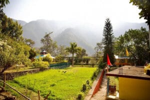 Lush garden courtyard with mountains in background