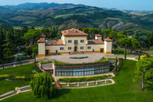 Elegant countryside villa with terracotta roof and hills