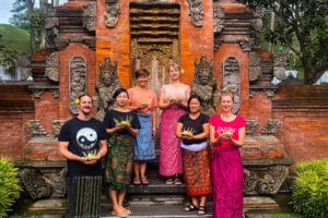 Six people holding offerings at Balinese temple