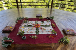Floral arrangement on blanket in wooden pavilion
