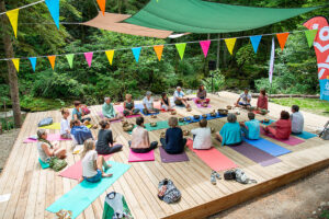 Outdoor meditation circle with singing bowls in forest