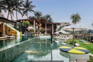 Luxury tropical resort with infinity pool and palm trees