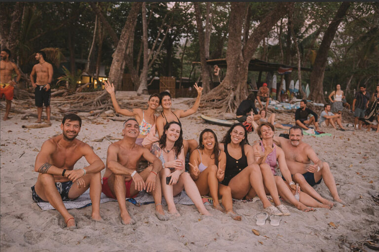 Group of friends smiling on tropical beach