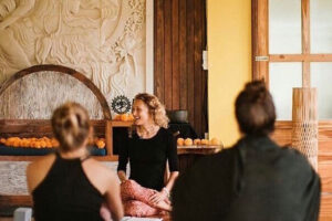 Yoga instructor leading class in serene studio