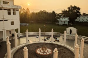 Sunrise over courtyard with yoga and Indian flag
