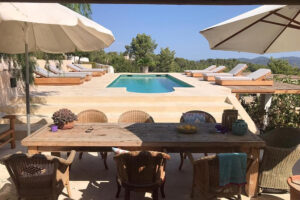 Luxury patio with pool and lounge chairs