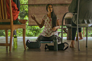 Woman speaking during small indoor group discussion