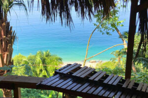 Wooden xylophone overlooking tropical turquoise ocean view