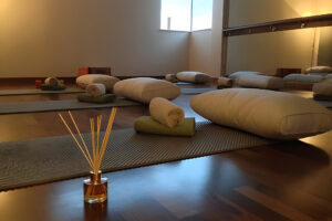 Serene yoga studio with mats and cushions