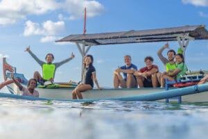 Group of friends on boat in ocean