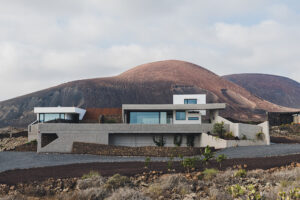 Modern minimalist house in volcanic mountain landscape
