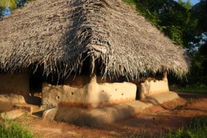 Traditional mud hut with thatched roof